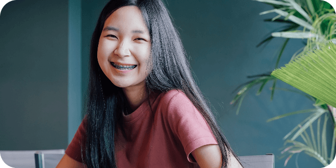 A smiling teen wearing braces.